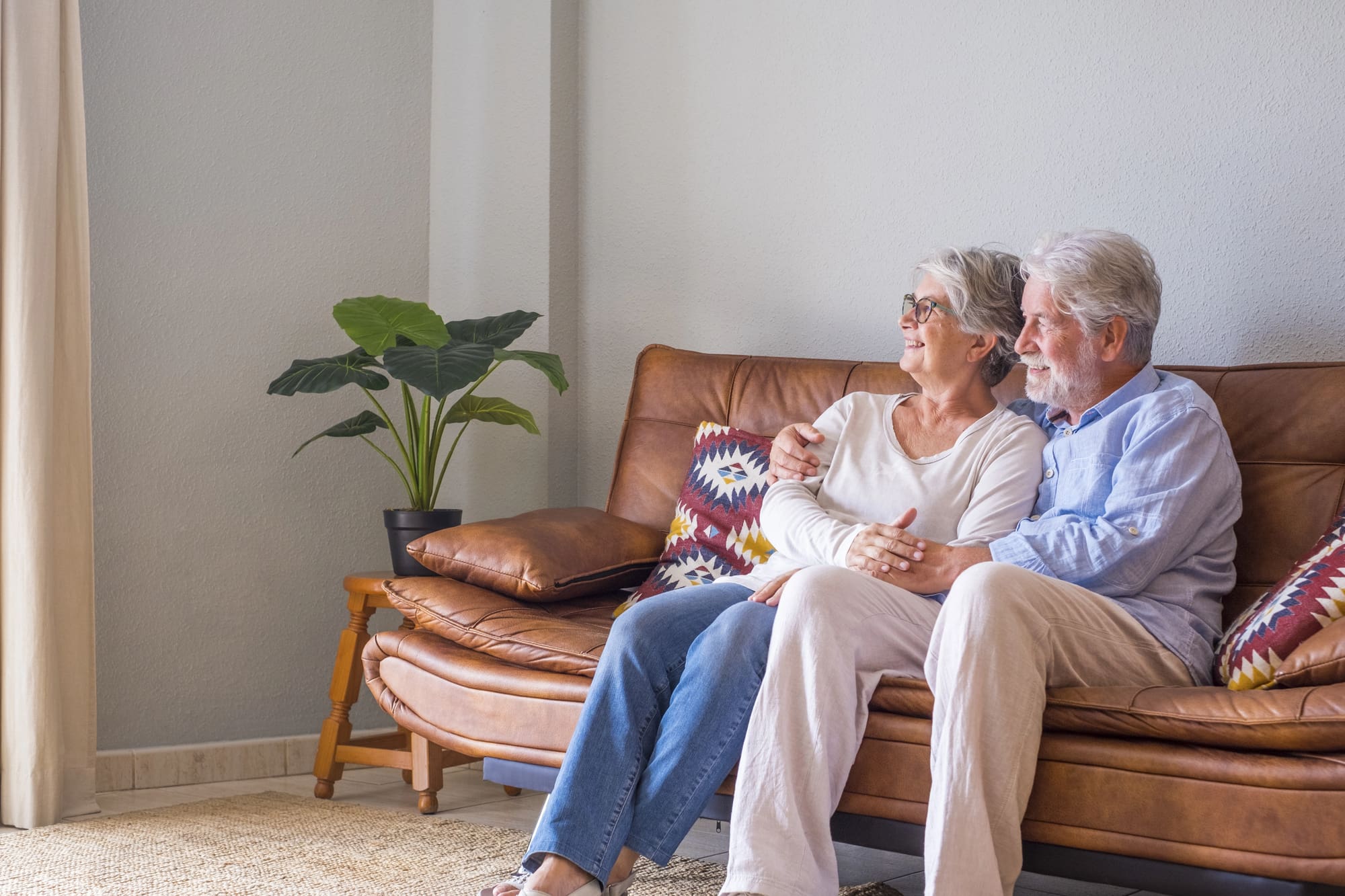 air conditioning system replacement Lynchburg solutions Senior couple enjoying comfortable temperature after air conditioning system replacement Lynchburg home service.