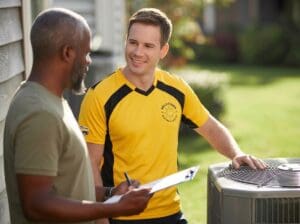 How do SEER2 ratings affect heat pumps: technician explains options during home visit.