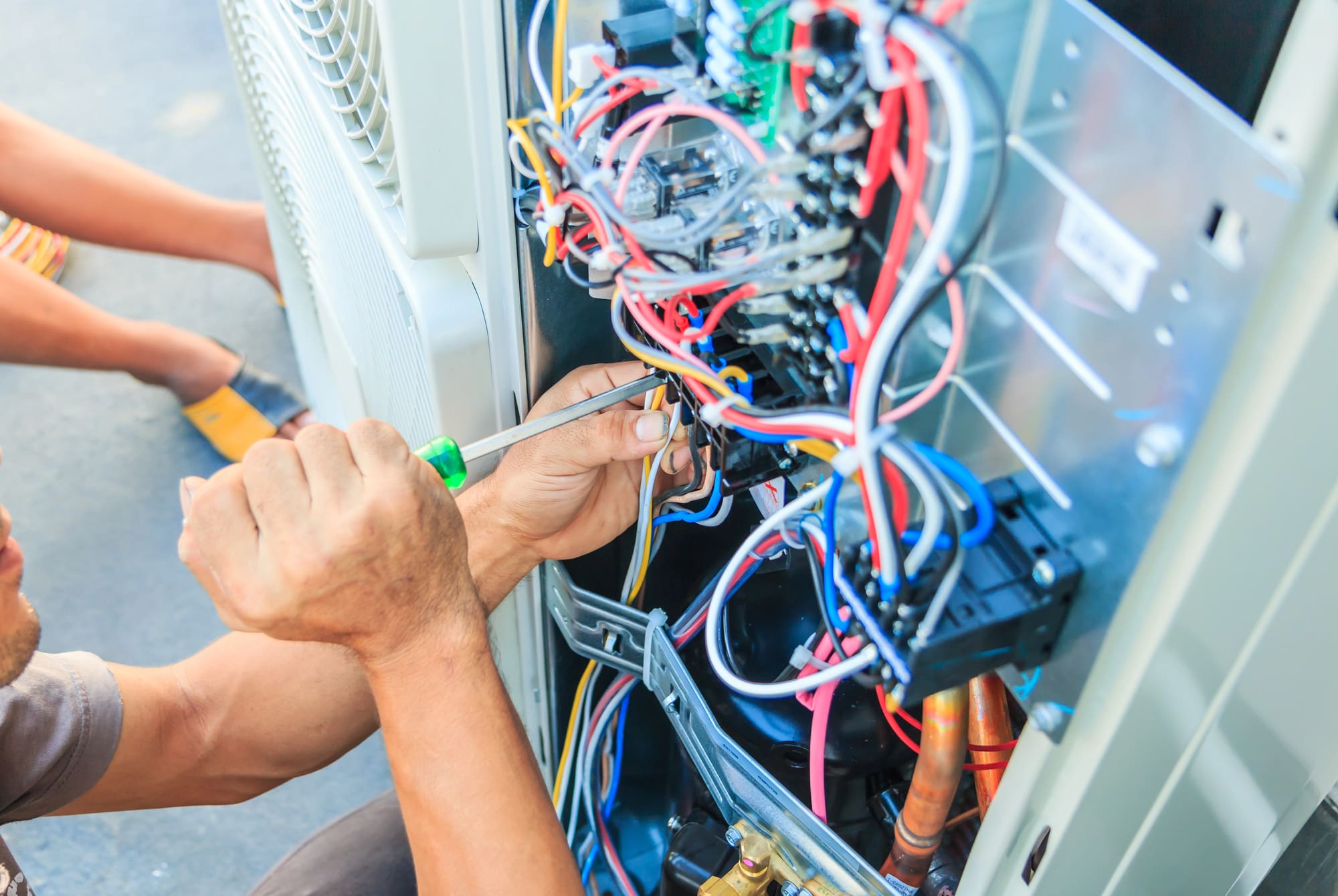 hvac services danville comprehensive HVAC Services Danville technician repairing electrical wiring in heating system